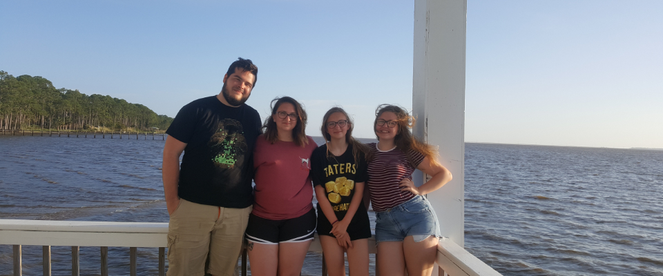 Mary’s family standing on a dock