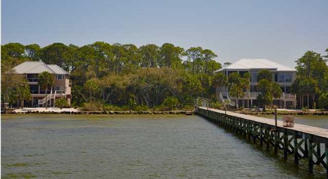 .88 acre Plantation bay front lot with shared boat dock