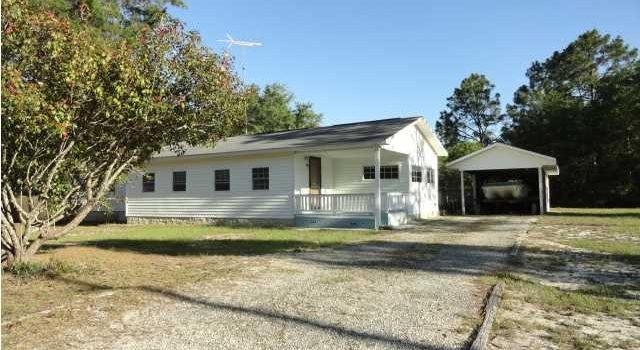 mobile home sitting on 2 city lots