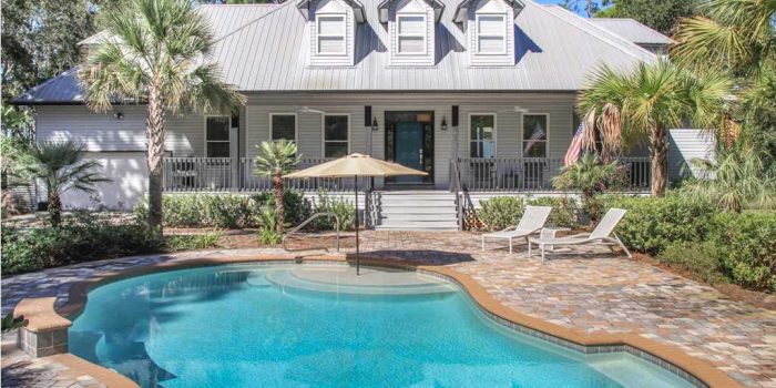 bay front home with private pool and boat dock located in Magnolia Bay subdivision